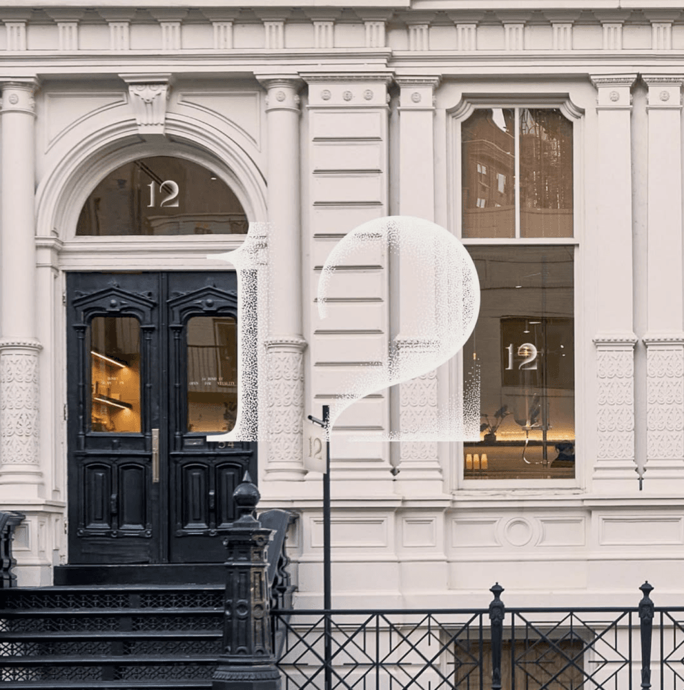12 Matcha’s white Bond Street storefront, with black doors and a large translucent 12 over the photograph.